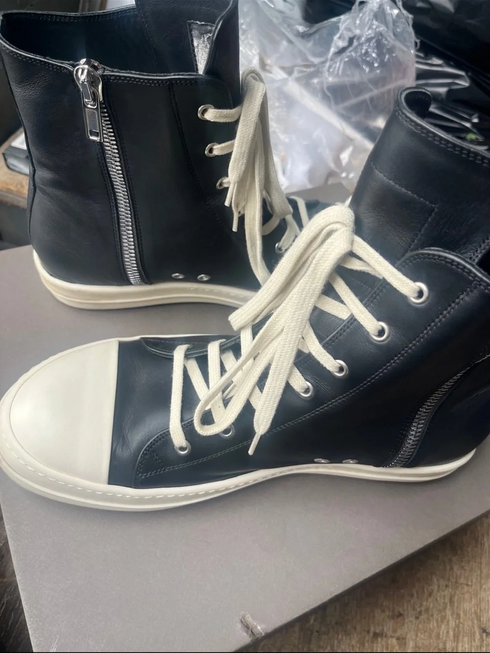Rick Owens Black Leather High-Top Boat Sneakers with White Toe Caps